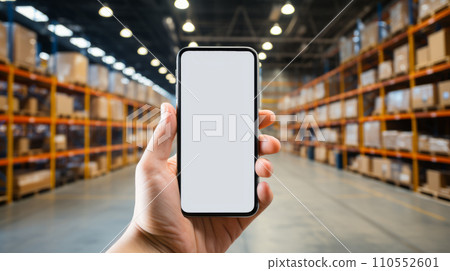 Smartphone mockup in male hand. Mobile phone with blank screen warehouse background. Advertisement application design or mock-up text. Storage app distribution business concept. Generative AI.  110552601
