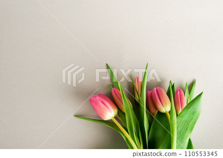 Pink tulips bouquet over gray background. Copy space Pink tulips bouquet over gray background. Copy space 110553345