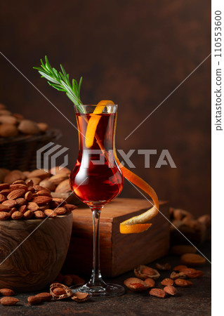 Italian liqueur Amaretto with almonds nuts. Italian liqueur Amaretto with almonds nuts. 110553600
