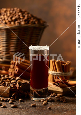 Coffee liquor on a brown background. Coffee liquor on a brown background. 110553610
