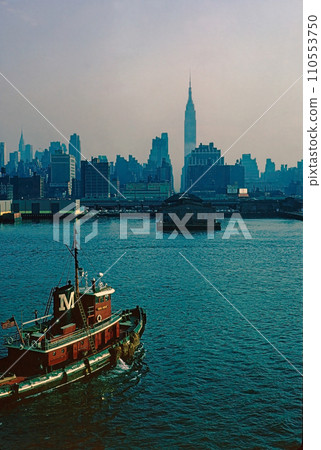 The skyline of New York City as seen from a ship in the state of New York in the United States of America in 1964 110553750
