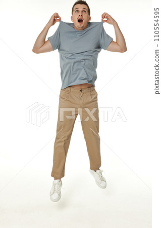 man holding himself by the shoulders isolated on white background 110554595