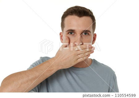 man covering mouth with hands on white background 110554599