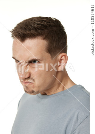 annoyed angry man shouting on white studio background 110554612