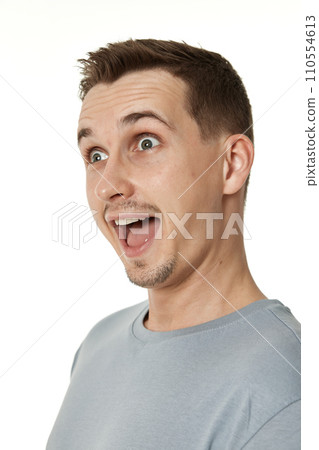 surprised guy looking at camera on white studio background 110554613