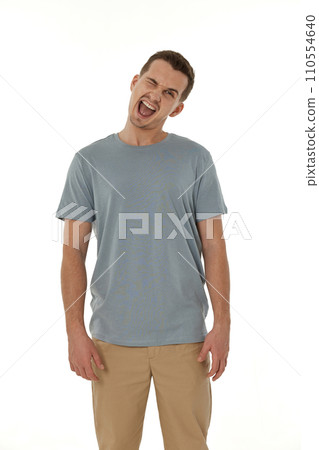 portrait of young happy man winking looking at the camera on white background portrait of young happy man winking looking at the camera on white background 110554640