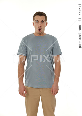 surprised guy looking at camera on white studio background 110554641