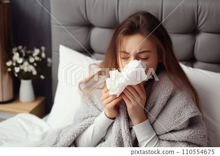 Cozy Deception: Young Girl Playfully Mimicking Sickness in Bed - Generative AI 110554675