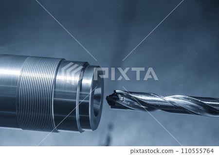 The CNC lathe machine drilling process the metal parts. 110555764