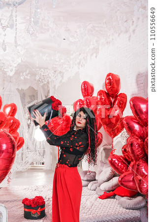Sexy brunette with balloons heart and roses 110556649