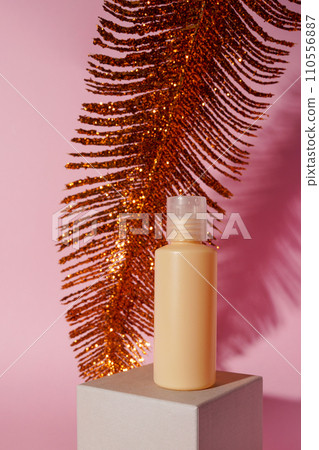 Mockup of yellow container for cosmetics, cream, serum, gel on yellow background with pink feather. Copy space Mockup of yellow container for cosmetics, cream, serum, gel on yellow background with pink feather. Copy space 110556887
