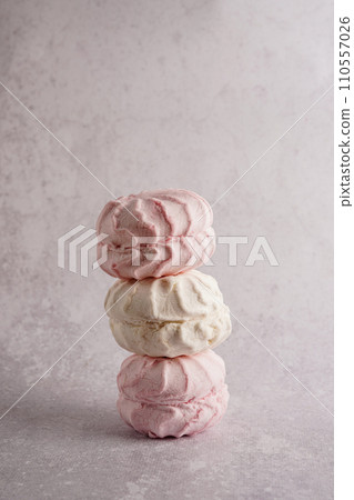 Pink and white homemade zephyr or marshmallow on gray concrete background 110557026