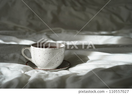 Cozy bed with a cup in the morning, breakfast in bedroom 110557027