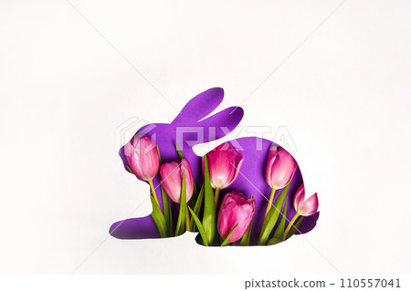 Bunny shape Easter holiday composition pink tulips flowers, white paper background. Spring natural concept. . Flat lay, top view Bunny shape Easter holiday composition pink tulips flowers, white paper background. Spring natural concept. . Flat lay, top view 110557041