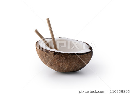 Half of coconut with coconut water on white background. Tropical summer healthy coconut cocktail. Half of coconut with coconut water on white background. Tropical summer healthy coconut cocktail. 110559895