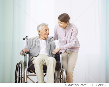 Elderly person in wheelchair and female helper 110559932