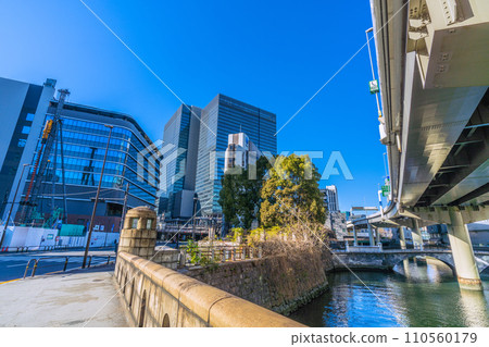 Tokyo cityscape in Japan: View of Otemachi from Tokiwa Bridge. On the right of the screen is the stone bridge "Tokiwa Bridge", in the back is the new Tokiwa Bridge = January 14, 2020 110560179