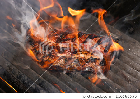 Searing and smoking ribeye steaks on grill Searing and smoking ribeye steaks on grill 110560559