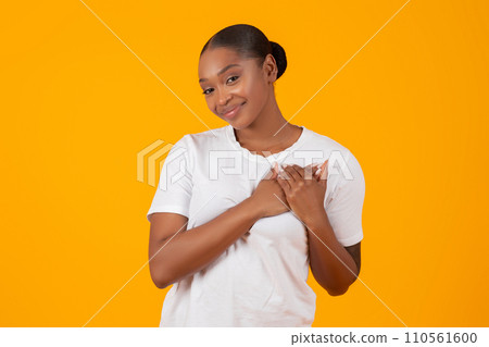 Grateful African American Young Lady Pressing Hands To Chest, Studio Grateful African American Young Lady Pressing Hands To Chest, Studio 110561600