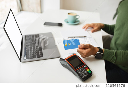 Customer freelancer using credit card for payment at cafe Customer freelancer using credit card for payment at cafe 110561676