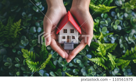 Hands holding car and house. Hands holding car and house. 110561970