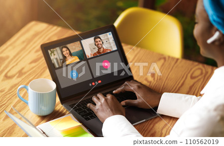 Black woman worker have webcam group conference with her coworkers 110562019