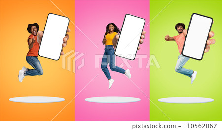 Three Cheerful People Jumping With Big Blank Smartphone And Pointing At Camera 110562067