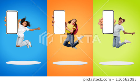 Check This. Cheerful Preteen Girls Jumping With Big Blank Smartphones In Hands Check This. Cheerful Preteen Girls Jumping With Big Blank Smartphones In Hands 110562085