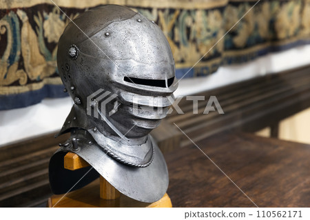 Medieval knight closed iron helmet close-up photo Medieval knight closed iron helmet close-up photo 110562171
