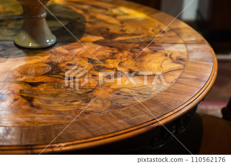 An empty round vintage wooden table, close up photo An empty round vintage wooden table, close up photo 110562176