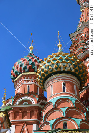 Colourful domes of St Basils cathedral on Red Square in Moscow in Russia. 110563415