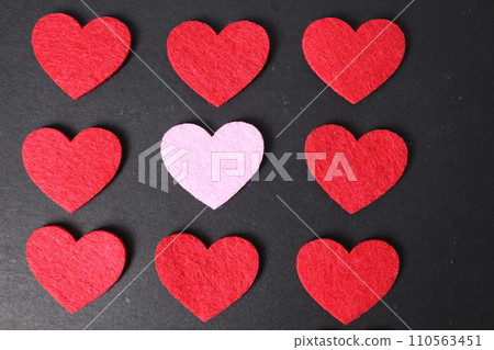 Background of red and pink hearts on a black background. Valentine's Day. Valentine's Day Concept Background of red and pink hearts on a black background. Valentine's Day. Valentine's Day Concept 110563451