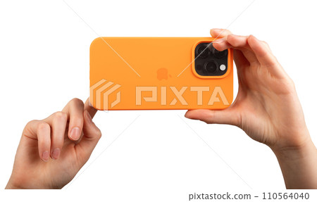 Berlin Germany December 21 2023 Hand holding iphone taking horizontal mobile photo isolated on white Berlin Germany December 21 2023 Hand holding iphone taking horizontal mobile photo isolated on white 110564040