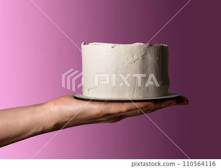Hand giving white blank bento cake, small dessert mockup 110564116