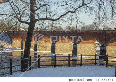 Kuldiga in winter. Old brick bridge over Venta rive. Latvia. High quality photo Kuldiga in winter. Old brick bridge over Venta rive. Latvia. High quality photo 110564374