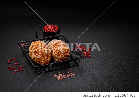 Delicious fresh cutlet or meatball Kiev style with filling 110564405