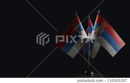 Small national flags of the Serbia on a black background 110565207