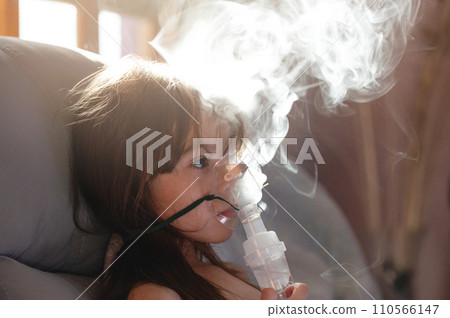 Girl kid patient with inhaler mask Girl kid patient with inhaler mask 110566147
