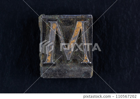 Antique vintage movable type alphabet letter M. 110567202