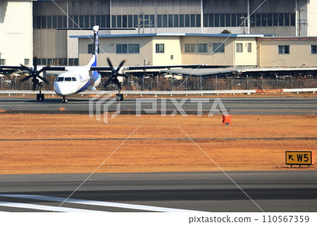 Osaka International Airport ANA Bombardier DHC8-Q400 Propeller Aircraft Takeoff Ready Senri Kawajiri Osaka International Airport ANA Bombardier DHC8-Q400 Propeller Aircraft Takeoff Ready Senri Kawajiri 110567359