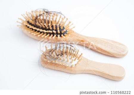 Hair loss fall with comb brush isolated on white background. 110568222
