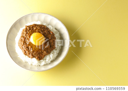 An overhead shot of keema curry topped with egg yolk An overhead shot of keema curry topped with egg yolk 110569359