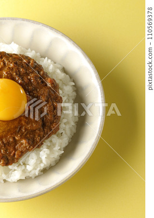 An overhead shot of keema curry topped with egg yolk An overhead shot of keema curry topped with egg yolk 110569378