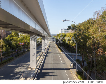 Elevated city road Hamaguchi Nanko Line and New Tram running through Osaka city Elevated city road Hamaguchi Nanko Line and New Tram running through Osaka city 110569891