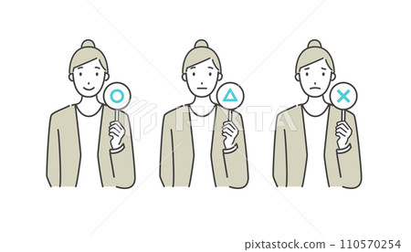 A woman working in an office holding a ○× plate 110570254