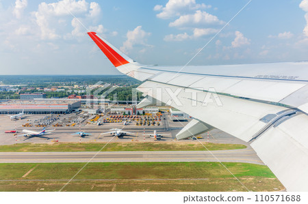 View from the airplane window during takeoff at Sheremetyevo airport at summer View from the airplane window during takeoff at Sheremetyevo airport at summer 110571688