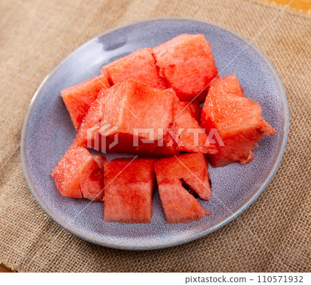 Pieces of ripe sweet juicy watermelon on plate Pieces of ripe sweet juicy watermelon on plate 110571932