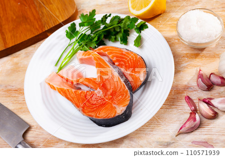 Fresh sliced steaks of salmon Fresh sliced steaks of salmon 110571939