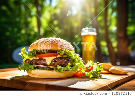 fresh burger on a wooden table with glass of cold fresh beer fresh burger on a wooden table with glass of cold fresh beer 110572113