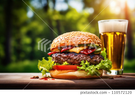 fresh burger on a wooden table with glass of cold fresh beer fresh burger on a wooden table with glass of cold fresh beer 110572120